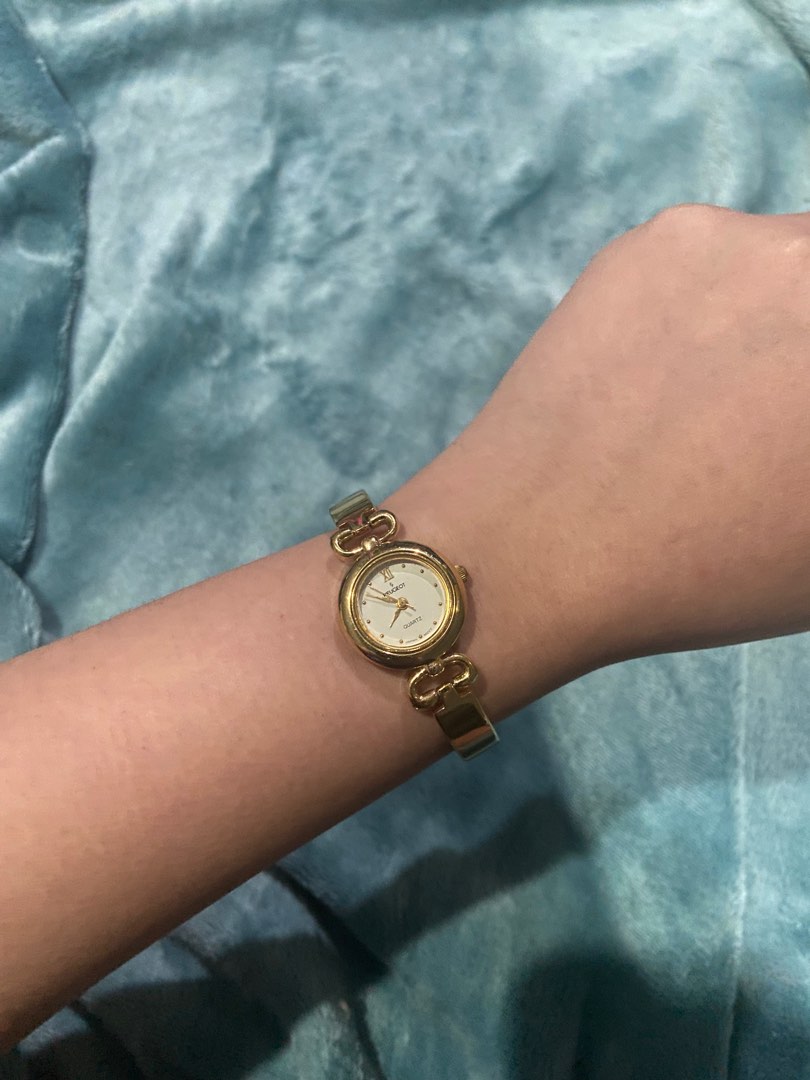 Peugeot gold watch hotsell
