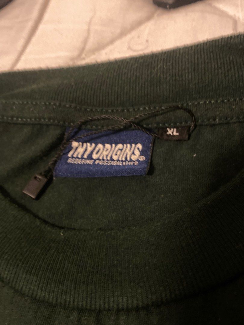 THY ORIGINS green tee - SIZE XL (Category: Tshirts & Polo Shirts ) located in Makati City. Submitted by Cobykobe (Listing ID 1274492033, Image 2). Description: 9/10 Condition Bought from Thy Origins Store Buyer will shoulder SF.