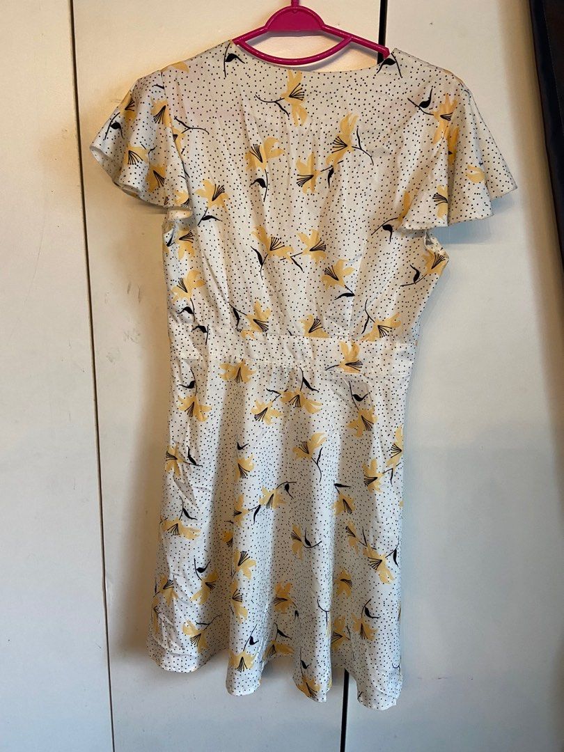 White dress with best sale yellow flowers