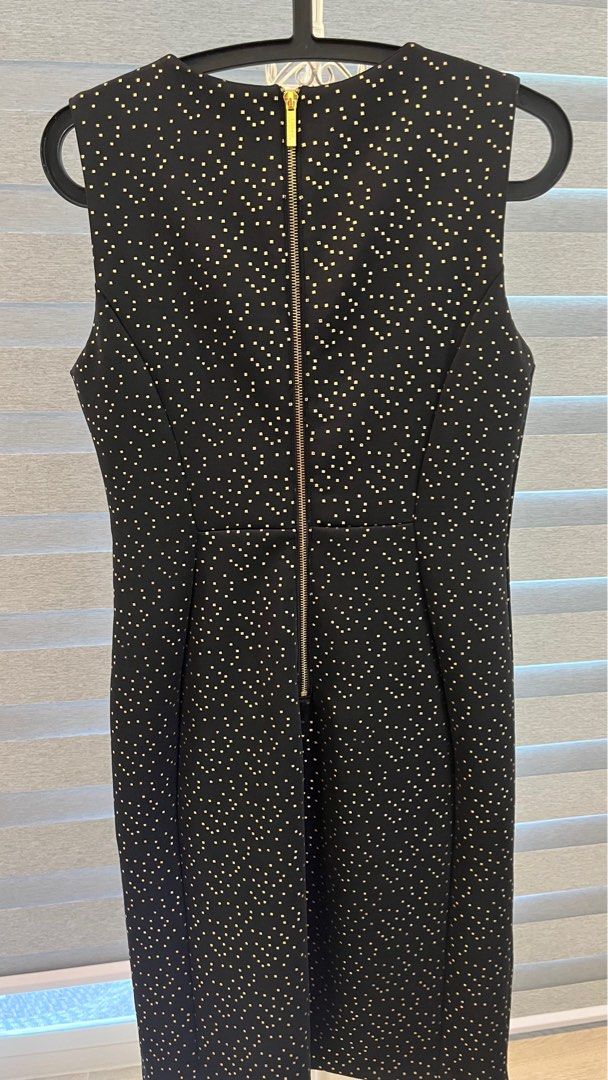 Carmen Marc Volvo black dress (Category: Dresses) located in Pasig City. Submitted by bituin18 (Listing ID 1274637270, Image 3). Description: Carmen Marc Valvo dress. Black with gold details. Used once only. Bought for 5k. Selling for 1900. Size 4. .