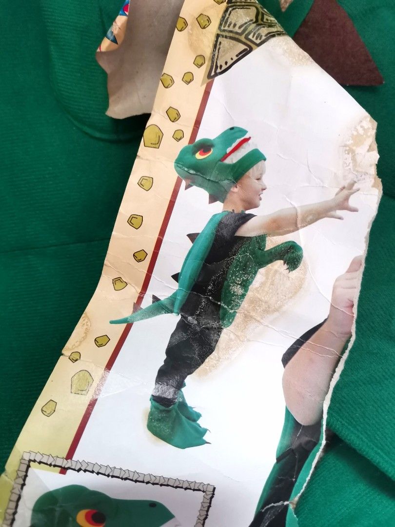 Dinosaur Costume (Category: Babies & Kids Fashion) located in Pasig City. Submitted by dehoarding (Listing ID 1274698958, Image 2). Description: Used condition See pics Fits 3-7yo approx See last pic. One tie on the waist has been pulled, mendable.