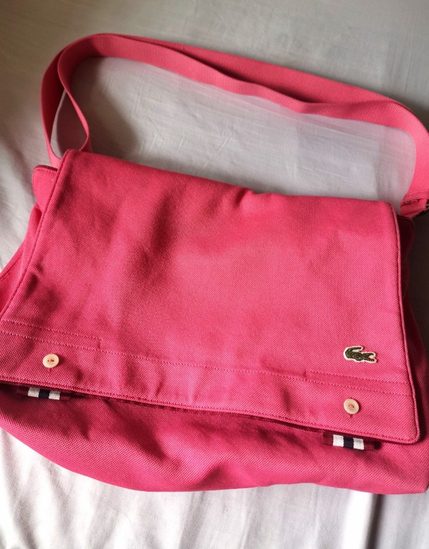 Lacoste Cross Body Bag (Category: Luxury Bags & Wallets) located in Pasig City. Submitted by dehoarding (Listing ID 1274705092, Image 1). Description: In good used condition Authentic Machine washable See picture (flaw on the last photo) Price further reduced.