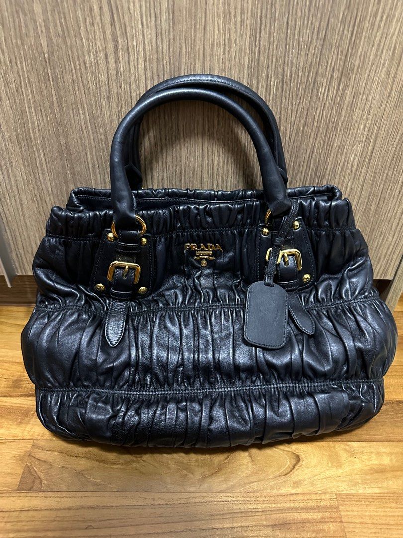 Prada Black Classic Quilted Leather Nappa Gaufre Nero Tu (Category: Bags & Wallets) located in Singapore. Submitted by lilhype (Listing ID 1274825530, Image 1). Description: rarely used in good condition stored in a temperature controlled environment taken out to air regularly my loss, your gain comes with receipt extra strap to be used as a crossbody bag original prada bag filler.