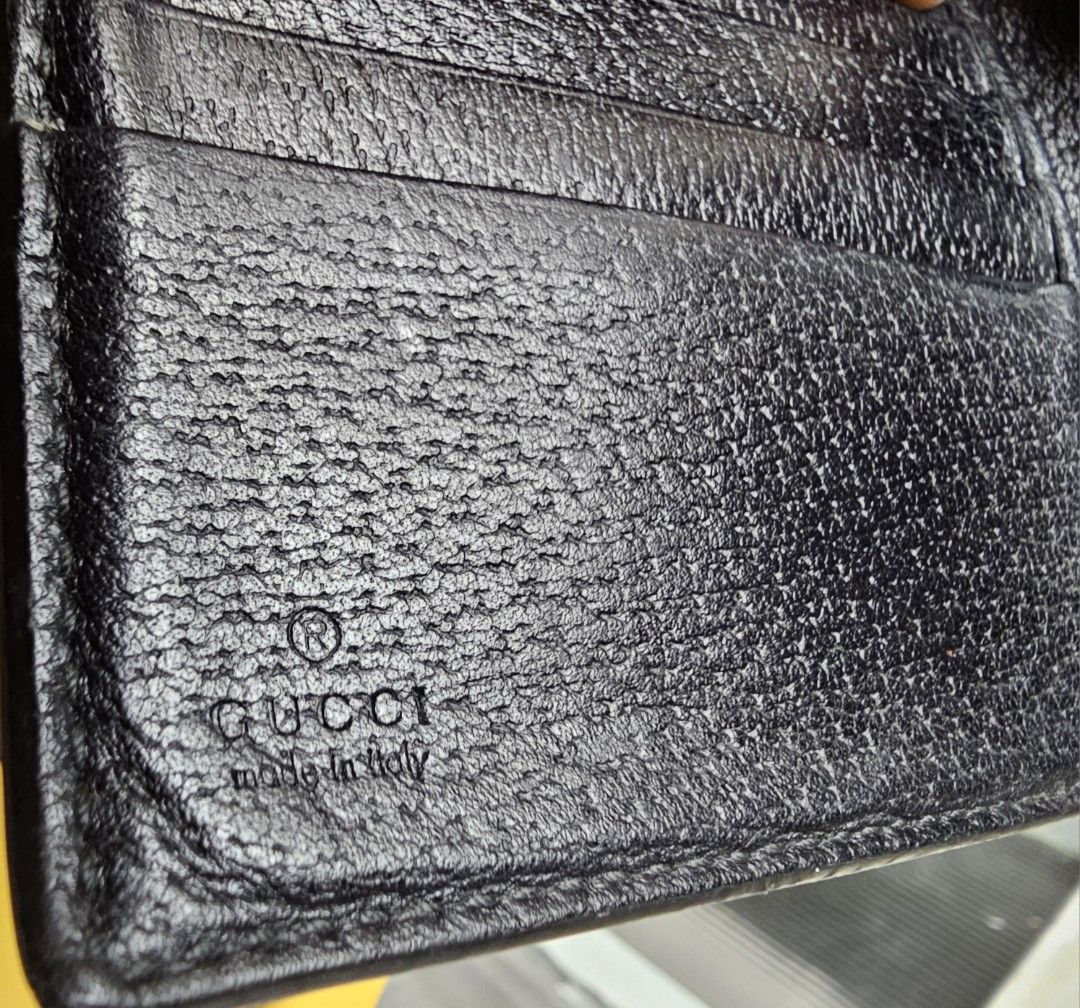 AUTH Gucci Bifold leather wallet (Category: Luxury Bags & Wallets) located in San Juan City. Submitted by thegoodthingsinlife (Listing ID 1274997337, Image 2). Description: Gucci bifold black leather wallet with serial code Leather is very good and soft no more box no flaws, no rips flaw: bee print outside the wallet is not visible anymore. **please do not make an offer if you are not buying. * No returns, please.
