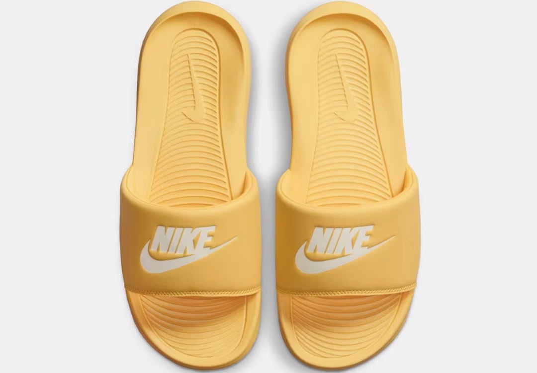 Pink and yellow nike slides online