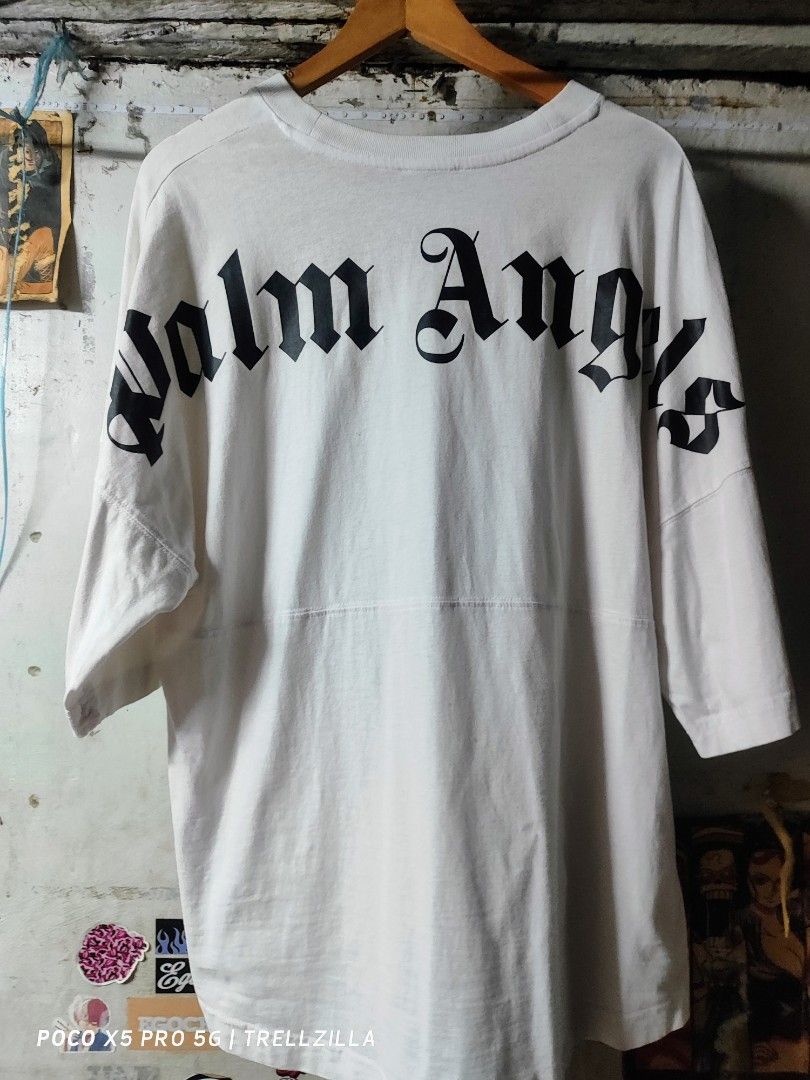 Palm Angels (Category: Tshirts & Polo Shirts ) located in Manila. Submitted by trellzilla666 (Listing ID 1275070023, Image 2). Description: 𝕻𝖆𝖑𝖒 𝕬𝖓𝖌𝖊𝖑𝖘 ₱750 + sf Excellent Condition Medium on tag but fits L-XXL (25x30-31) No issue naman pero need wash na lang para mukhang bago talaga Quezon City : Sm North/Munoz 📍 Rfs: nakatambak na lang di na nagagamit. Dm me..