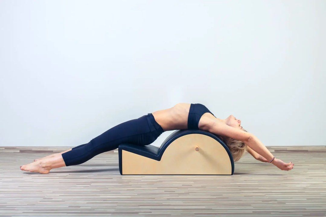 Pilates Arc / Spine Corrector (Category: Toning & Stretching Accessories) located in Singapore. Submitted by minsteo (Listing ID 1275076118, Image 1). Description: Beautiful black leather, maple wood Pilates Arc. Comes with a wooden dowel as a removable insert. Selling because of relocation. Item is packed and ready for shipment. .