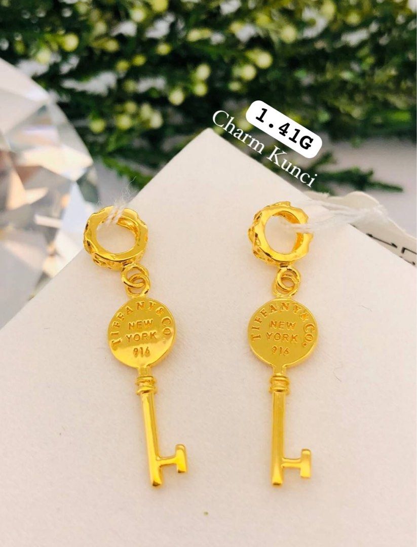 Gold best sale key pendant