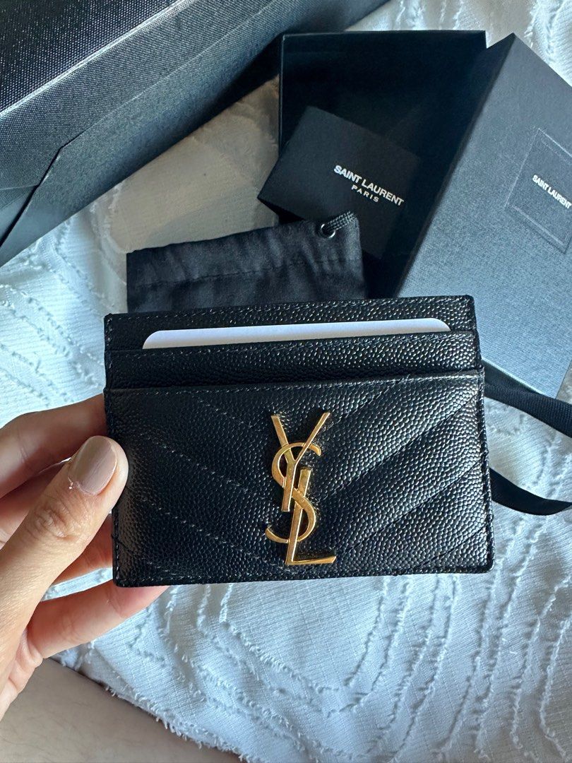 Authentic YSL Card Holder (Category: Luxury Bags & Wallets) located in Bacoor. Submitted by conclaseph (Listing ID 1269079593, Image 2). Description: 🌸 Just recently bought this YSL Card Holder from a pasabuy shop in Paris 🌸 Authentic!!! Money-back once proven fake 🌸 it has 4 card slots with a larger slot in the center 🌸 It comes complete with a dust bag, paper bag, box and care cards RFS: Will get a bigger wallet instead .