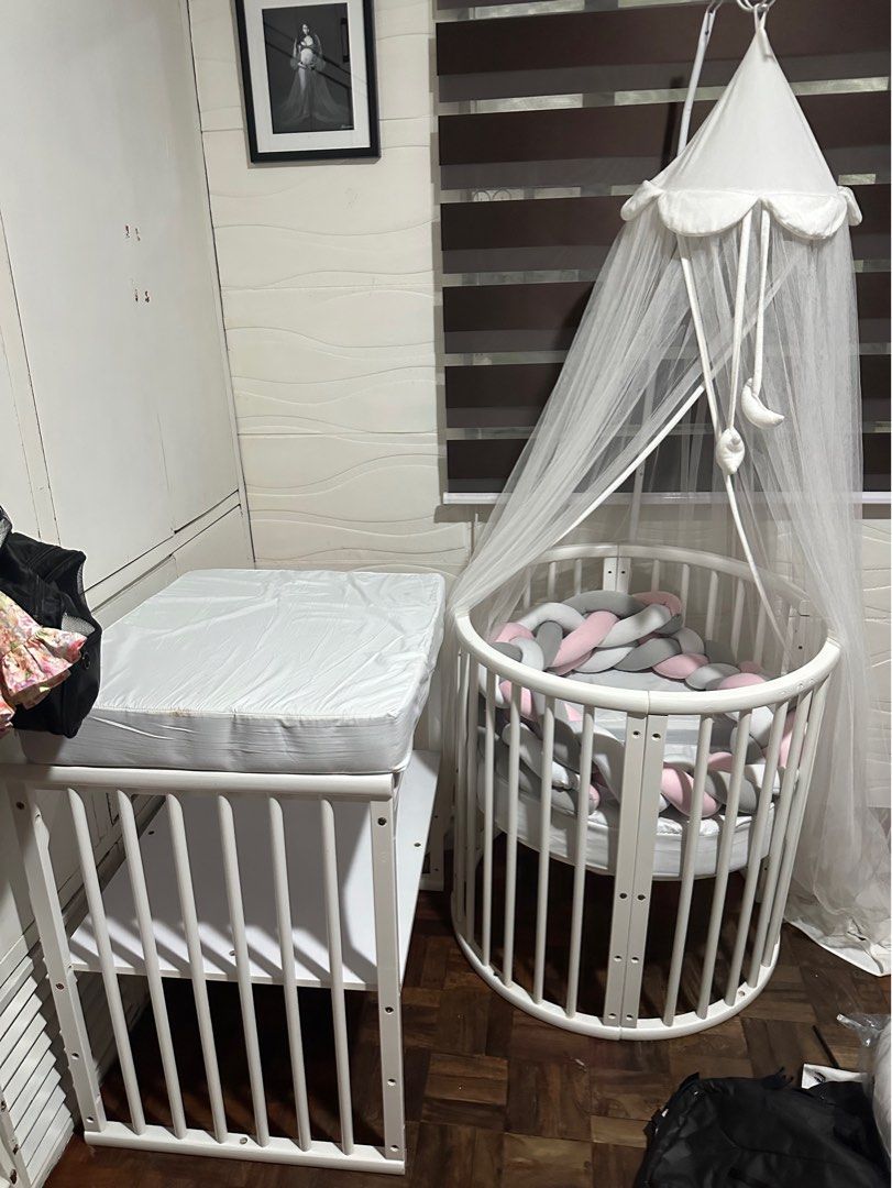 Crib 5in1 (Category: Cots & Cribs) located in Pasig City. Submitted by msjoyce612 (Listing ID 1269282092, Image 3). Description: Can turn into round crib w changing station for newborn baby Oval crib you lo become a little bit bigger Can connect sa bed Can turn into study table when your lo will be a toddler Included na ung foam Mosquito net Braided bumper Nursing pillow 2pcs Sobrang ganda po nito Di kau magsisisi Bought it for 25k di pa included