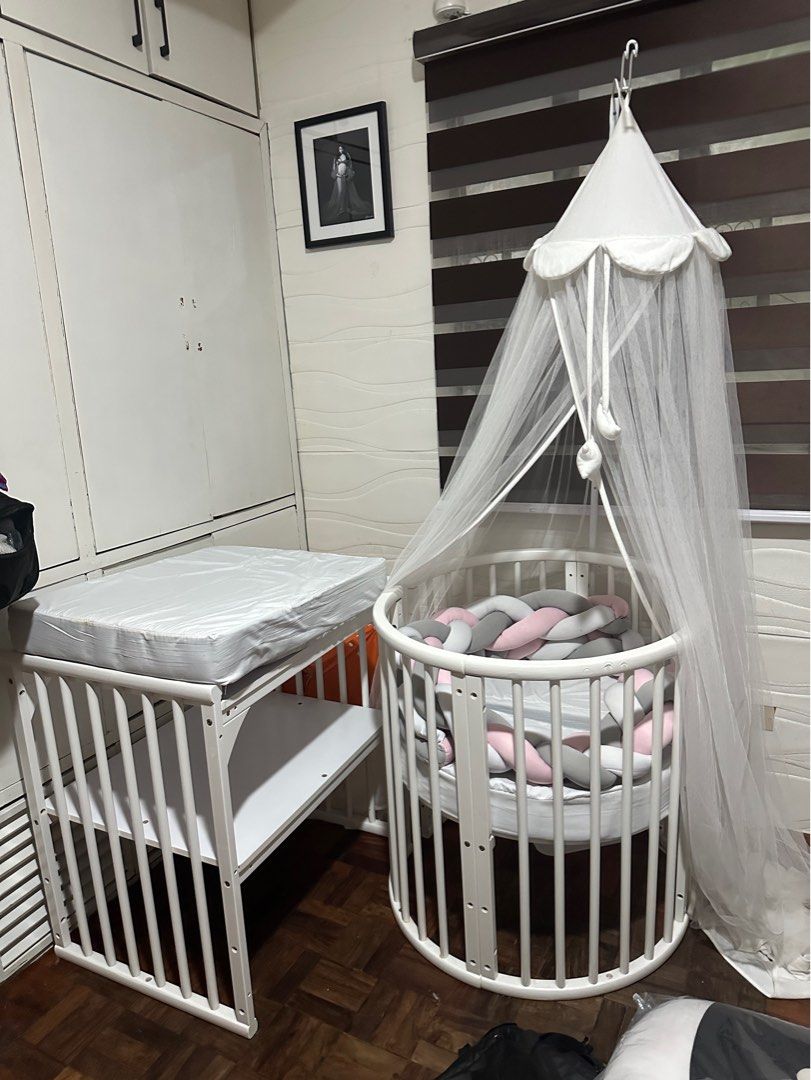 Crib 5in1 (Category: Cots & Cribs) located in Pasig City. Submitted by msjoyce612 (Listing ID 1269282092, Image 2). Description: Can turn into round crib w changing station for newborn baby Oval crib you lo become a little bit bigger Can connect sa bed Can turn into study table when your lo will be a toddler Included na ung foam Mosquito net Braided bumper Nursing pillow 2pcs Sobrang ganda po nito Di kau magsisisi Bought it for 25k di pa included
