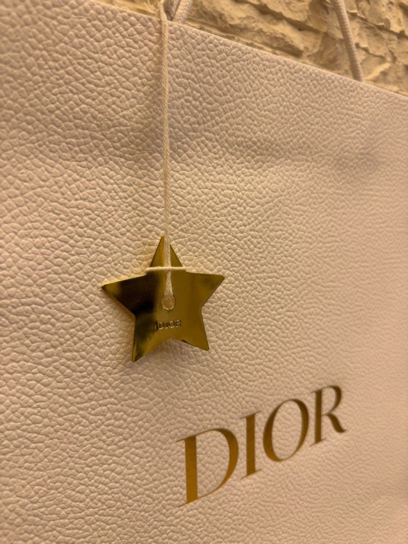 Dior Paper Bag with Dior Star Charm (Category: Luxury Accessories) located in San Fernando. Submitted by mnlt_o (Listing ID 1269208264, Image 2). Description: Authentic From Dior, Paris See photos for condition OAD: 44 L x 36.2 W x 17 D cm Price: 2,500 Location: San Fdo Pamp..