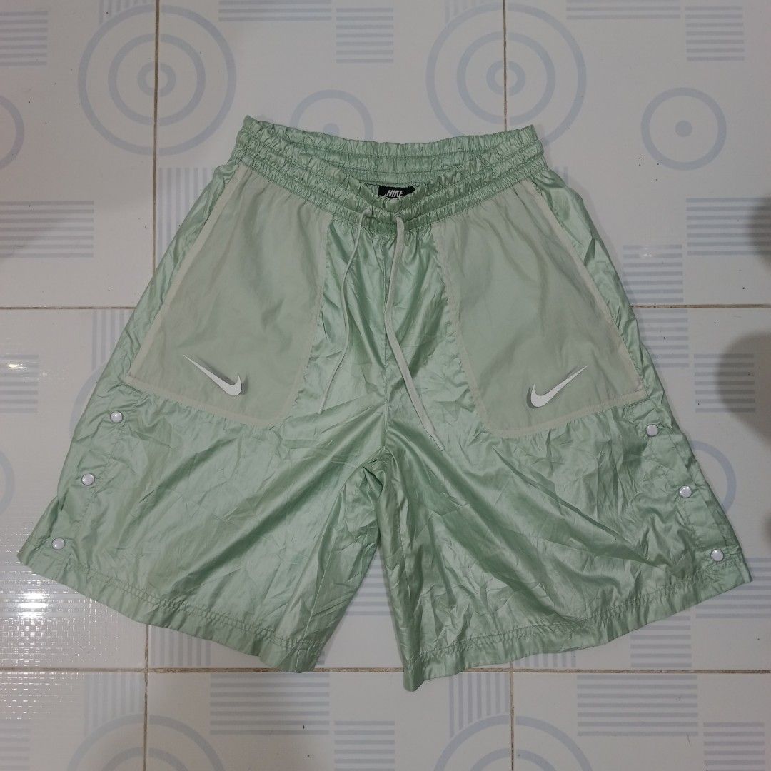 Nike oversized swoosh pocket shop green shorts