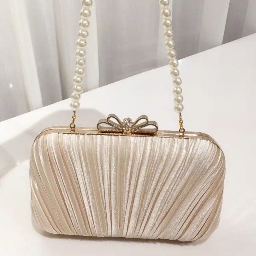 Champagne satin clutch bag outlet