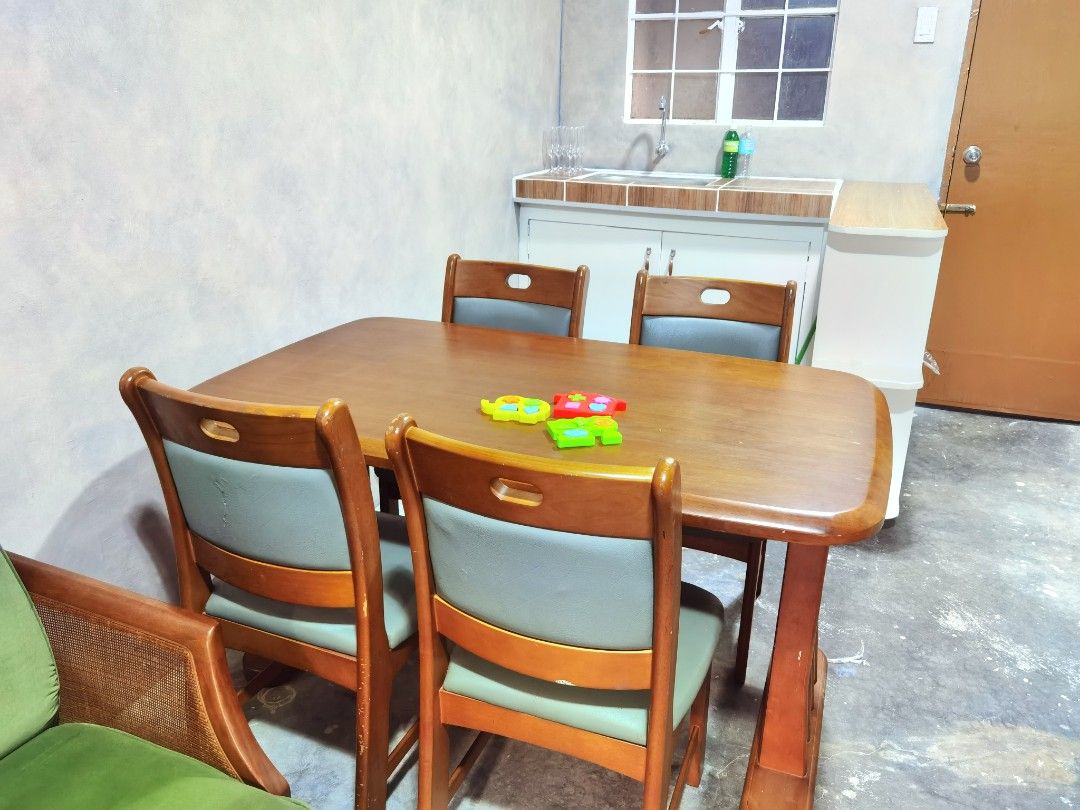 Solid Wood Dining Set - 4 seater (Category: Tables & Sets) located in Manila. Submitted by paperierome (Listing ID 1269271634, Image 3). Description: Solid Wood Dining Set 4 chairs - blue green soft foam leather upholstery. Fairly used with minor scratches but no major damage, you can resand and revarnish. Heavy | Made of premium solid hardwood. Buyer pick-up is highly recommended. RFS: will upgrade interior design. #smallhouse #furnitures #dinin