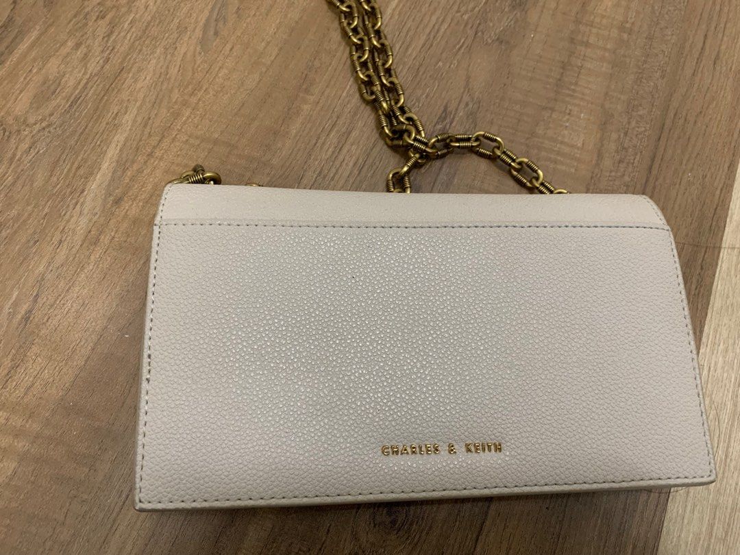 CHARLES KEITH White Gold Chain Sling Bag. Price is Negotiable