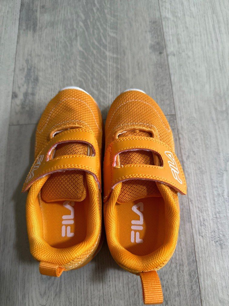 Orange and yellow fila shoes store