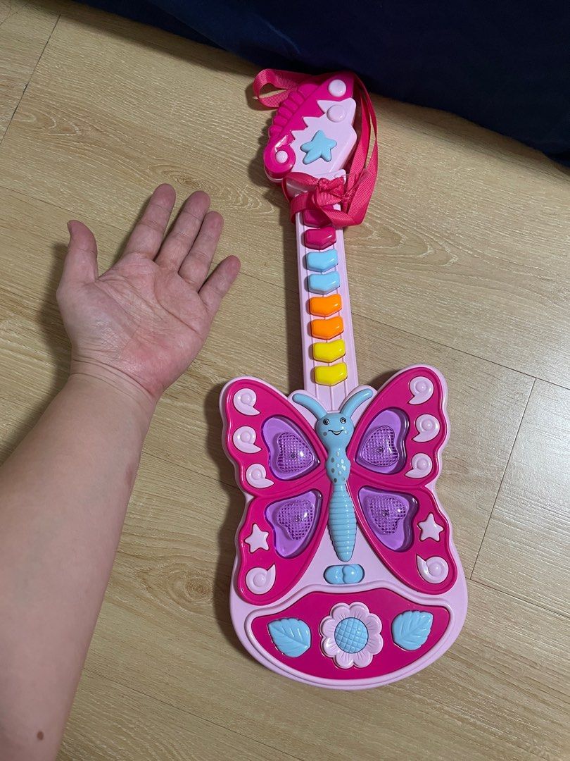 Guitar with sound (Category: Musical Instruments) located in Quezon City. Submitted by fayetrustnpixiedust (Listing ID 1275348855, Image 1). Description: Needs batteries Lanyard/lace is broken.