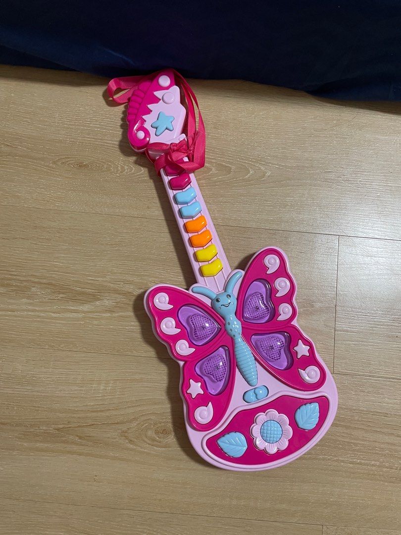 Guitar with sound (Category: Musical Instruments) located in Quezon City. Submitted by fayetrustnpixiedust (Listing ID 1275348855, Image 2). Description: Needs batteries Lanyard/lace is broken.
