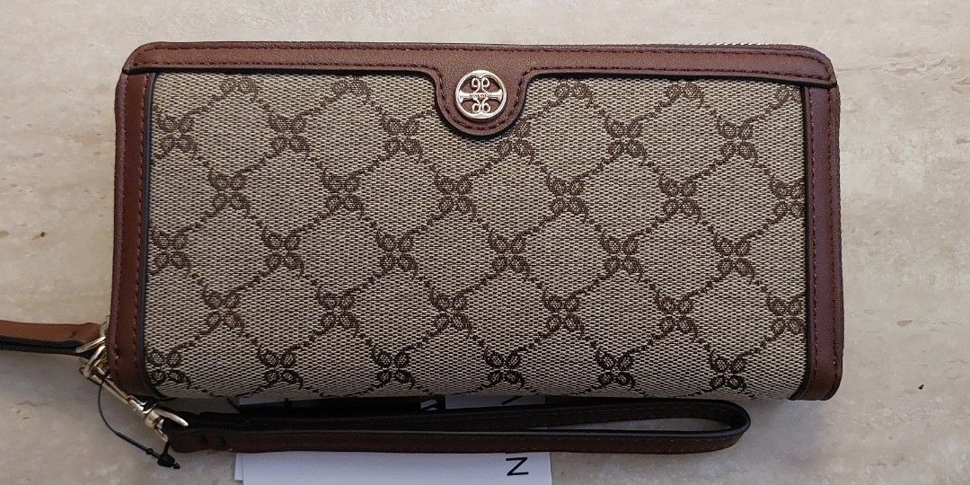Nine West Wallet with lanyard (Category: Luxury Bags & Wallets) located in Pasig City. Submitted by tomoegozen_0925 (Listing ID 1275236182, Image 1). Description: Fits 6in phone. 12 card slots. Payment via gcash or UB/BPI bank transfer..