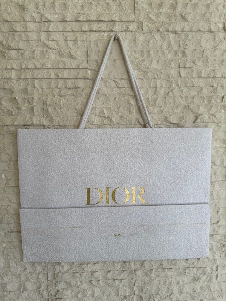 Dior Paperbag with Dior Star Charm Medium (Category: Luxury Accessories) located in San Fernando. Submitted by mnlt_o (Listing ID 1275464961, Image 3). Description: Authentic From Dior, Paris See photos for condition OAD: 30 L x 42 W x 13 D cm Price: 1,800 + 250 shipping Location: San Fdo Pamp..