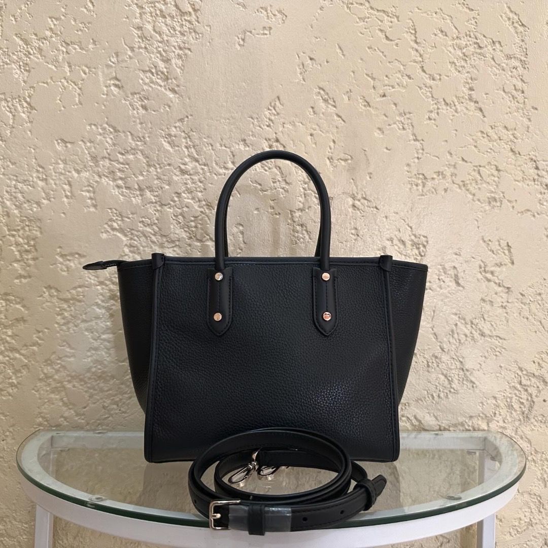Kate Spade Ella Tote Small (Category: Luxury Bags & Wallets) located in Cebu City. Submitted by brendabebot (Listing ID 1275539164, Image 3). Description: Kate Spade Ella Tote Small Material: Leather Can be worn as top handle, shoulder or crossbody Condition: 9/10 Inclusions: Provided dust bag, Removable long strap Price: Php 10,000 Mode of payment: BDO, PNB, Security Bank, EastWest, Gcash, Credit Card (Paypal additional fee 5%) All items listed 