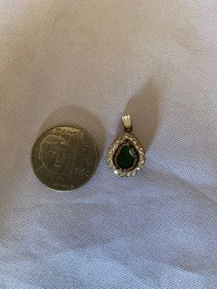 Silver with bronze and emerald Very old damage from the pendant