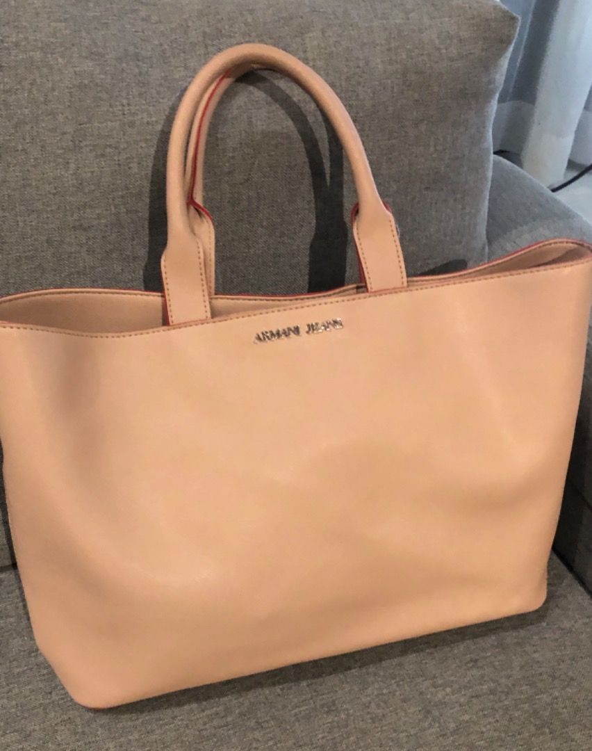 ARMANI JEANS tote (Category: Luxury Bags & Wallets) located in Davao. Submitted by mliza1020 (Listing ID 1269390588, Image 1). Description: Armani Jeans Tote with pouch. No flaws. Color: Champagne Dimension: L 48 x H 28 x W 12 cm (approx) .