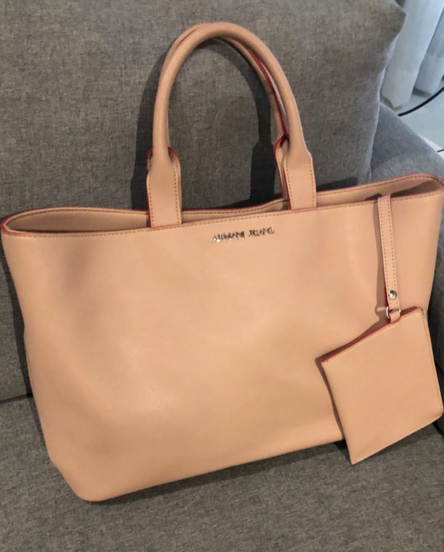 ARMANI JEANS tote (Category: Luxury Bags & Wallets) located in Davao. Submitted by mliza1020 (Listing ID 1269390588, Image 2). Description: Armani Jeans Tote with pouch. No flaws. Color: Champagne Dimension: L 48 x H 28 x W 12 cm (approx) .