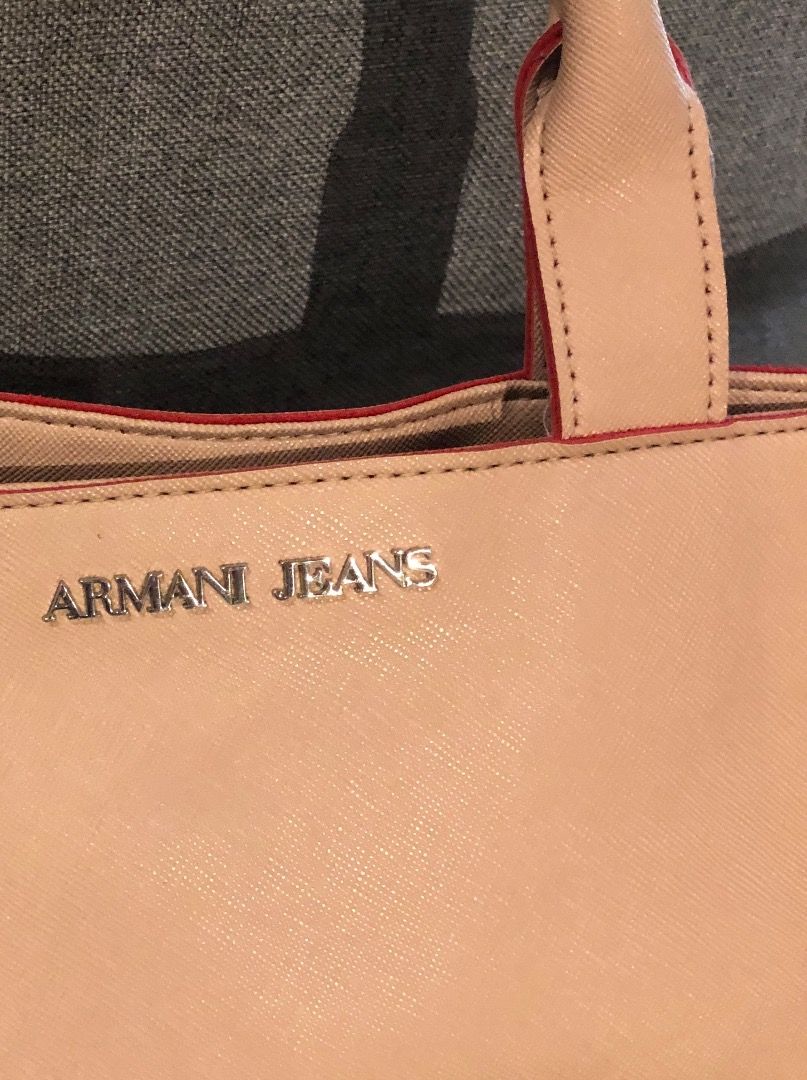ARMANI JEANS tote (Category: Luxury Bags & Wallets) located in Davao. Submitted by mliza1020 (Listing ID 1269390588, Image 3). Description: Armani Jeans Tote with pouch. No flaws. Color: Champagne Dimension: L 48 x H 28 x W 12 cm (approx) .