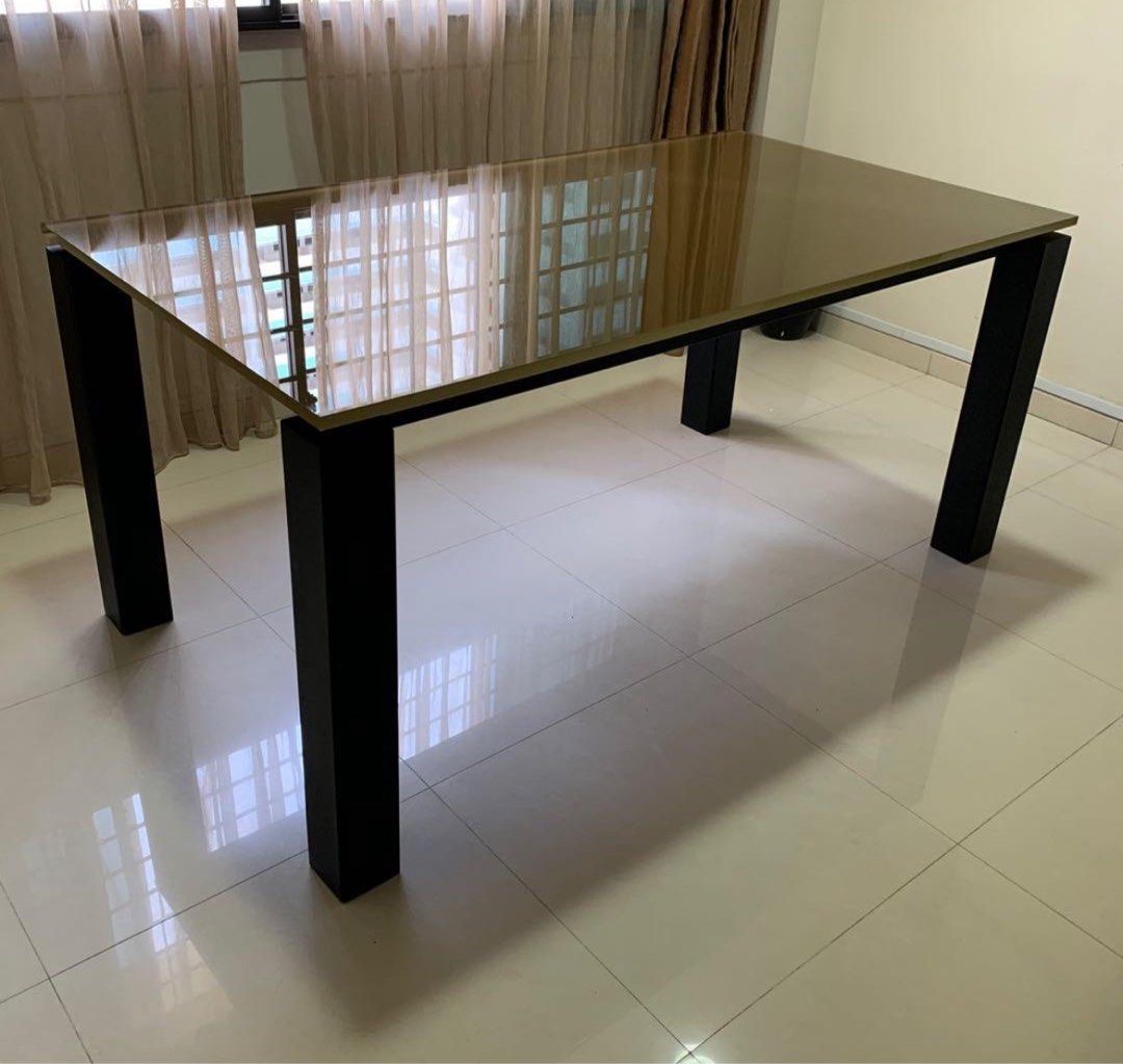 Dining Table (Category: Tables & Sets) located in Singapore. Submitted by greencart (Listing ID 1269345609, Image 1). Description: Neat look Glass Top Solid Frame Place comfortably six chairs You can opt to change the colour of the glass .
