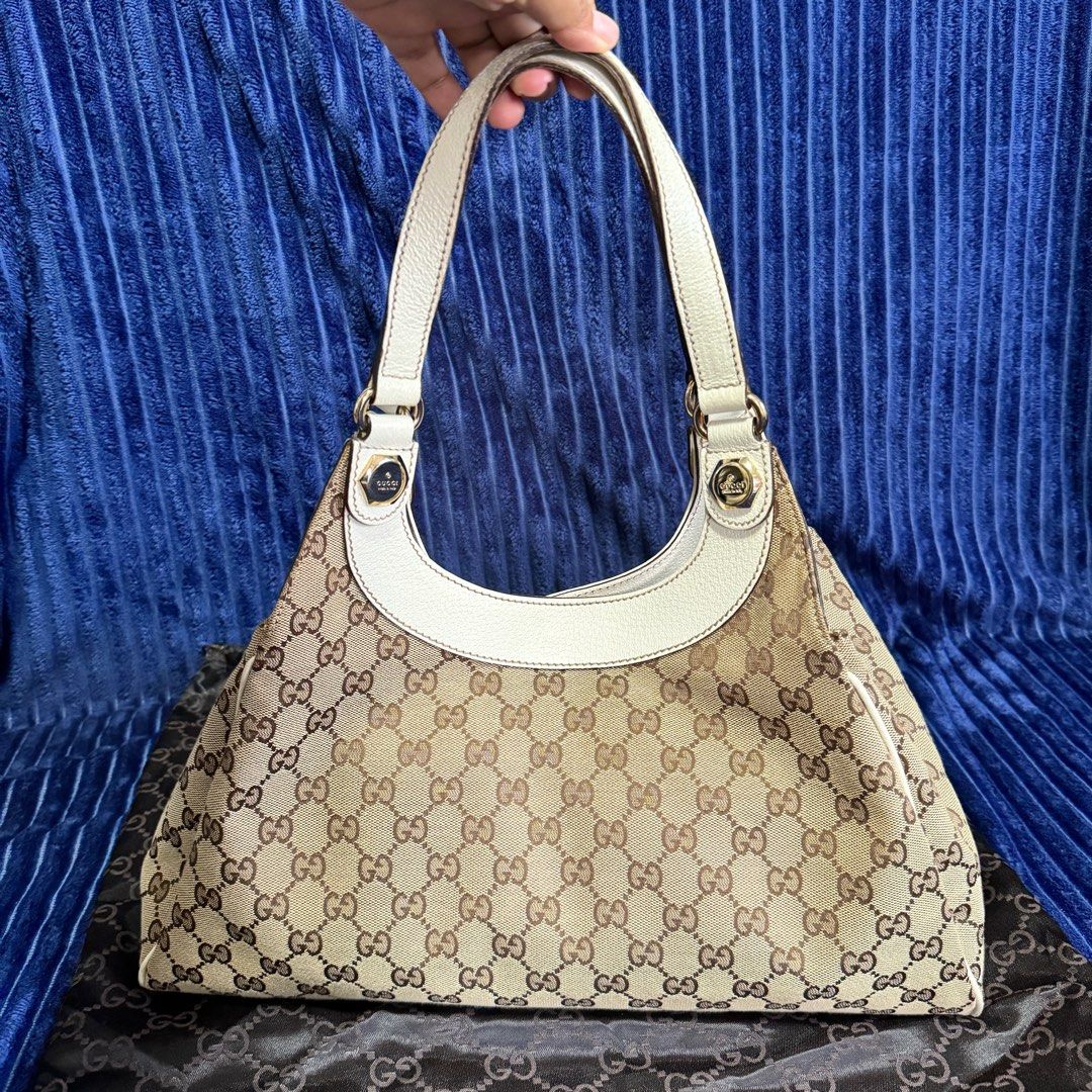 Gucci White Charmy Monogram bag medium (Category: Luxury Bags & Wallets) located in Imus. Submitted by leslian.era (Listing ID 1269287694, Image 1). Description: RUSH SALE PRELOVED 💯 Gucci White Charmy Monogram bag medium 100% authentic comes with dustbag Perfect as gift or pang-awra No cracks, no rubs, clean interior, no smell Condition: 9/10 W 36cm x H 20cm x D 7.5cm SF/ Lalamove/LBC/Grab shouldered by buyer Location: Imus, Cavite .