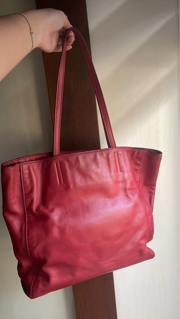 Pre loved Miu Miu Tote Bag (Category: Luxury Bags & Wallets) located in Las Pinas. Submitted by monicasellsstuff (Listing ID 1269358381, Image 2). Description: Original Miu Miu bag Bought in Italy. With dustbag only. RFS: not used anymore Issues: signs pf usage lalo na sa handle. Loc: Las Piñas MOP: BPI Bank transfer MOD: lalamove.