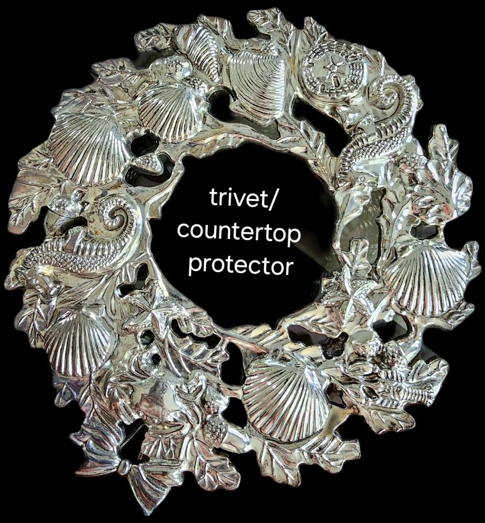 Silver plated trivet/countertop protector (Category: Cookware & Accessories) located in Manila. Submitted by great_buys (Listing ID 1268727836, Image 1). Description: Serve in style with this silverplated antique finish trivet with marine animals design, 9 3/8 inches in length. Made by International silver company. Comes in original box..