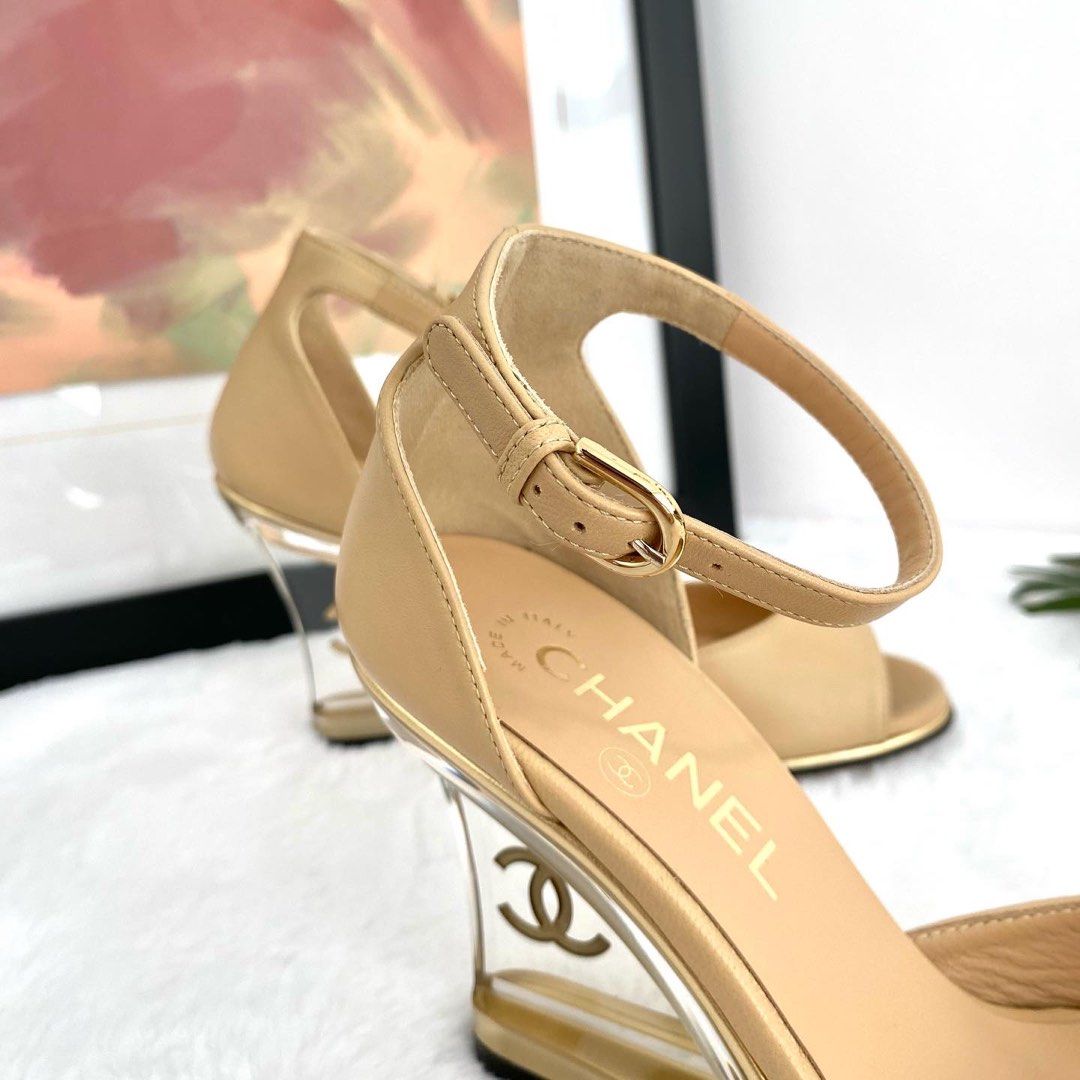 💯% Authentic Chanel Beige Leather Clear Gold CC Mules Ankle Strap Wedge  Heels, Luxury, Sneakers & Footwear on Carousell