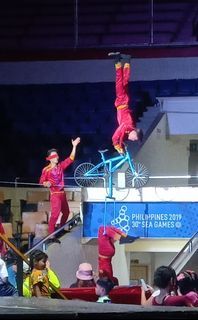 Acrobatics show with high wire walker and bicycle act