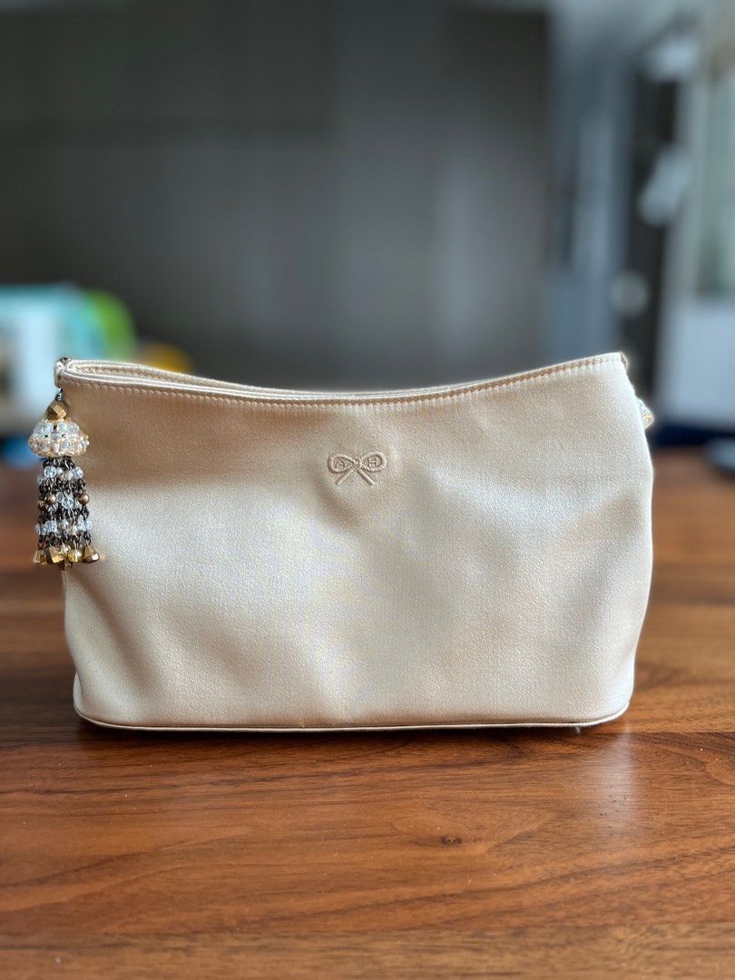 Champagne gold clutch deals bag