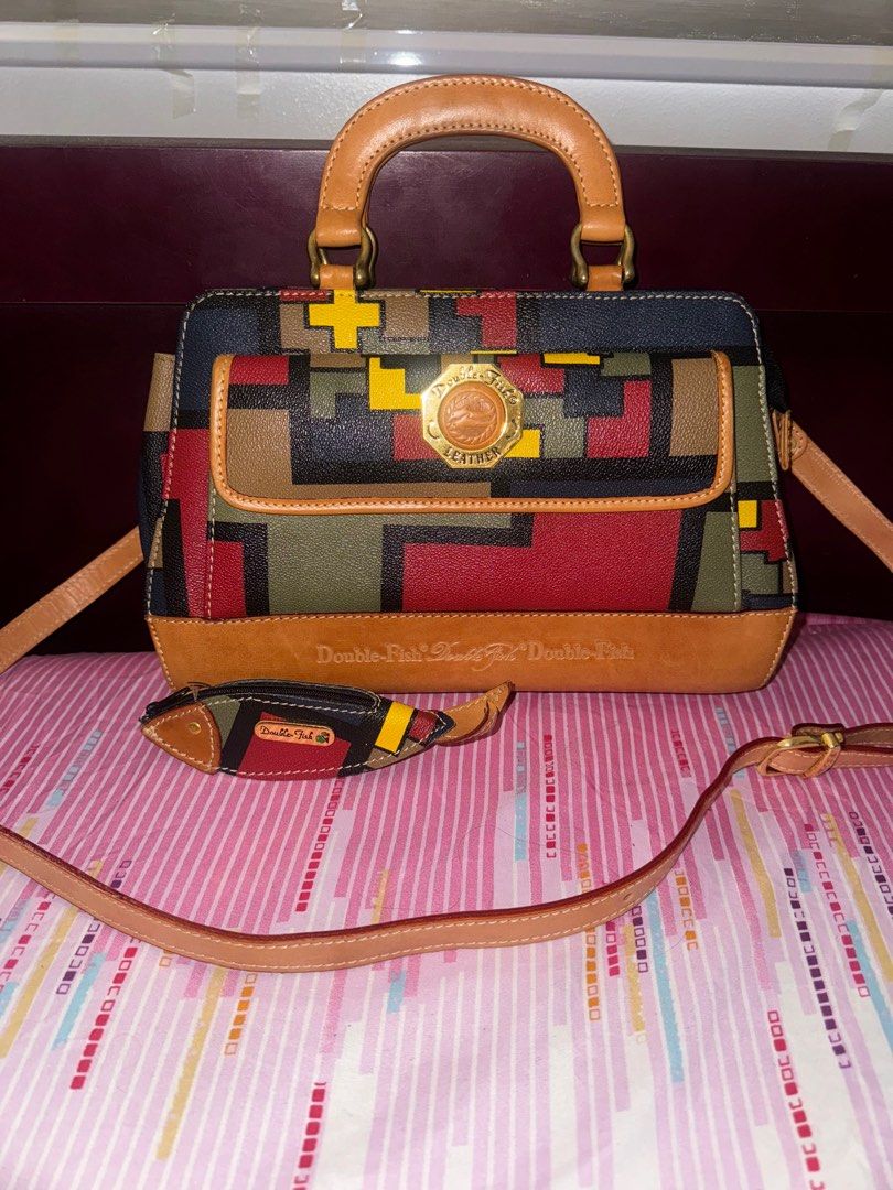 Double-Fish 2 Way Leather Satchel Bag (Category: Luxury Bags & Wallets) located in Quezon City. Submitted by lix12 (Listing ID 1269483036, Image 1). Description: ❣️💯Authentic ❣️With detachable and adjustable straps ❣️1 external magnetic closure compartment ❣️ 3 internal compartments -2 zippered- ❣️comes with double-fish coin purse ❣️Measurements: 29cm”L x 21cm”H x 9cm”W ❣️Japan bought ⛔️Disclaimer: TlJ boutique is independent and not affiliated 