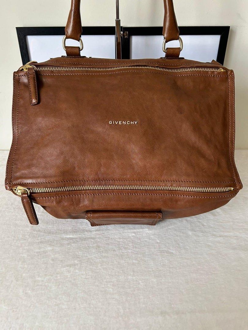 Givenchy Large Pandora Bag (Category: Luxury Bags & Wallets) located in Manila. Submitted by bagislifeshop (Listing ID 1269529276, Image 2). Description: ☑️Available in Manila ✅Condition: 8/10 ✅Colour: Brown in GHW ✅Size: 15” X 9.5” X 10” ✅Material: Calf leather ✅Inclusion: Dustbag and long strap .