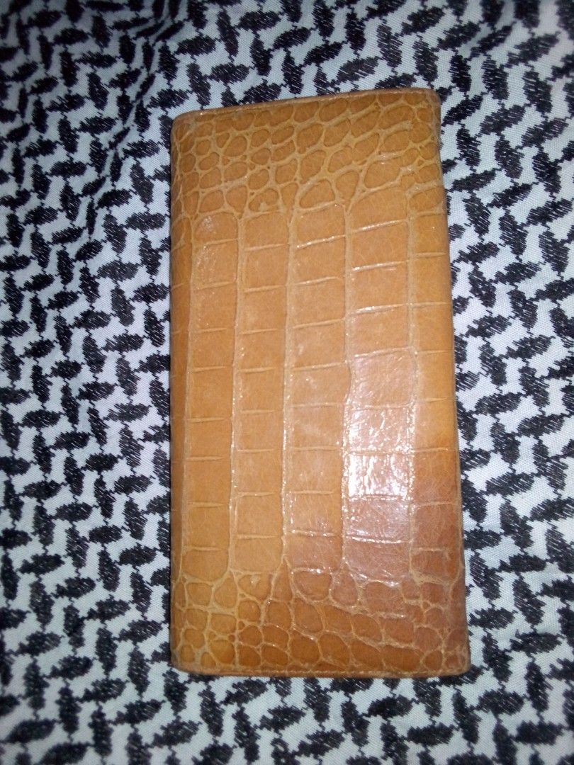 Miu Miu Crocodile Embossed Long Wallet (Category: Luxury Bags & Wallets) located in Calapan. Submitted by estheronl (Listing ID 1269634786, Image 2). Description: Miumiu long wallet Authentic Flaws: Nag-dark na color sa ibang parts, fading sa metal Mop: Gcash, Paymaya, Bpi Shipping couriers: J&t, LBC Shipping sched: Wed, Sat..