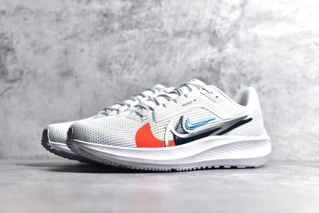 white nike running shoes with black swoosh