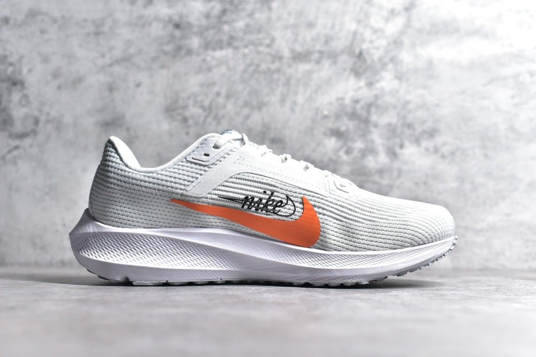 White nike shoes shop with orange swoosh