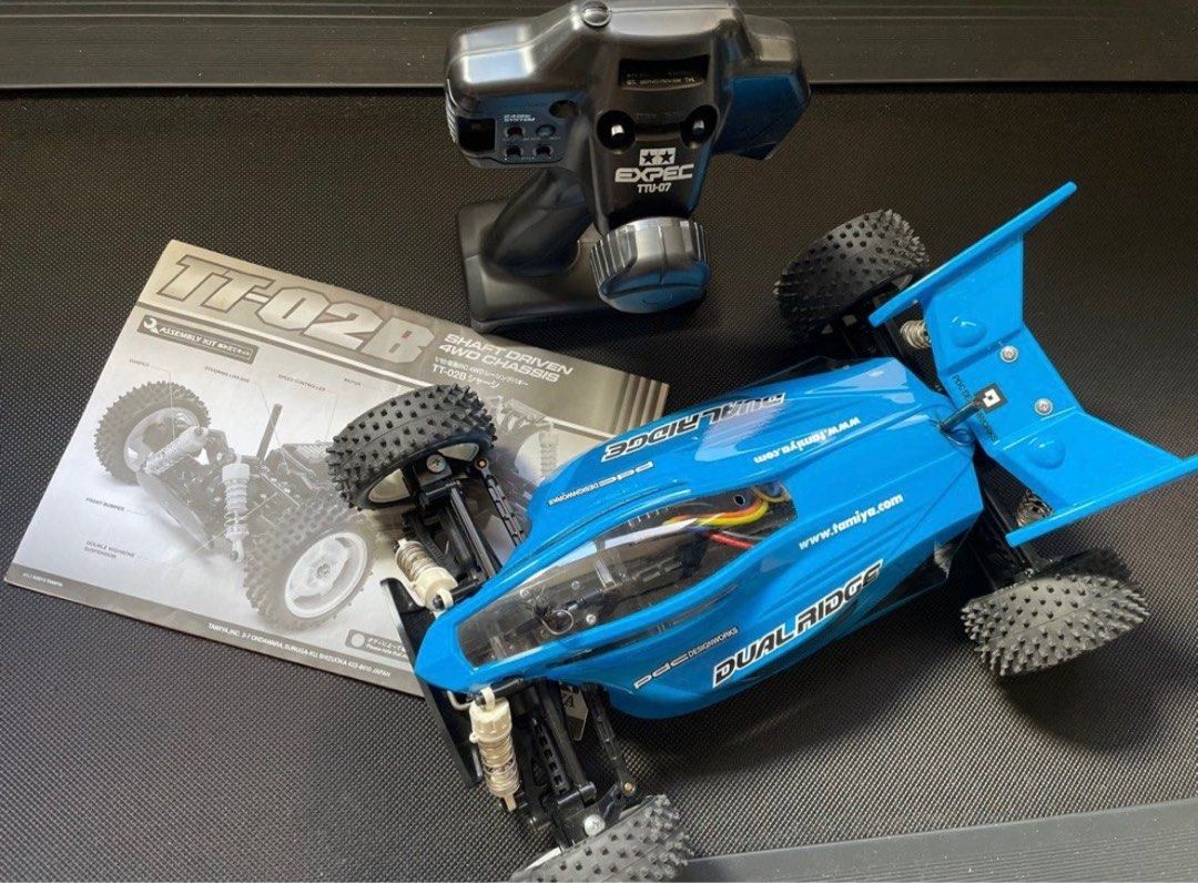 1/10 RC Tamiya (Category: Remote Control Toys) located in Marikina City. Submitted by quickbird.6e17d1 (Listing ID 1269834322, Image 2). Description: - includes remote contol - charger Note: battery included but may have to be changed due to not used and stocked in box This is the Radio Controlled, Electric Powered, 1/10 scale, TT-02B Dual Ridge Buggy Kit. FEATURES: Chassis: Plastic, TT-02B-uses TT-02 chassis as a base and adds longer suspension 