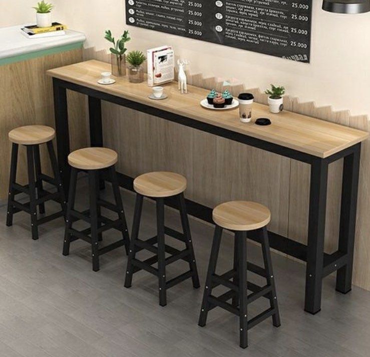 Bar table (Category: Tables & Sets) located in Singapore. Submitted by trasturebox (Listing ID 1269799952, Image 1). Description: table measurements: 140x40x100 Table top: light tint nut brown Black frame Used less than 2 months Minor dents due to moving (see last few pictures) Dented side can place against the wall Price stated for 1 Real life picture in 2nd picture Bar stool chairs availed or sale too: Check out ‘Sliver metal high stool chair f