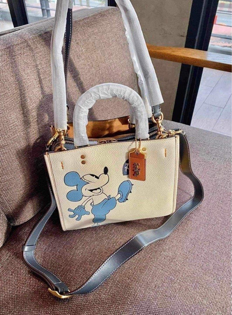 DISNEY × COACH Rogue 25 w/ Mickey Mouse (Category: Cross-body Bags) located in Rizal. Submitted by LuxbyMarifrance (Listing ID 1269896828, Image 1). Description: 🏷️ 3,800 only + SF 💼 DISNEY × COACH Rogue 25 w/ Mickey Mouse 📏 31cm (L) × 25cm (H) × 15cm (W) 📌 with dust bag and paper bag ✨All trademarks, logos and brand names are reserved and property of the original brand owners. #coachph #authenticqualitybagsph #authenticqualitybags #lowestpri