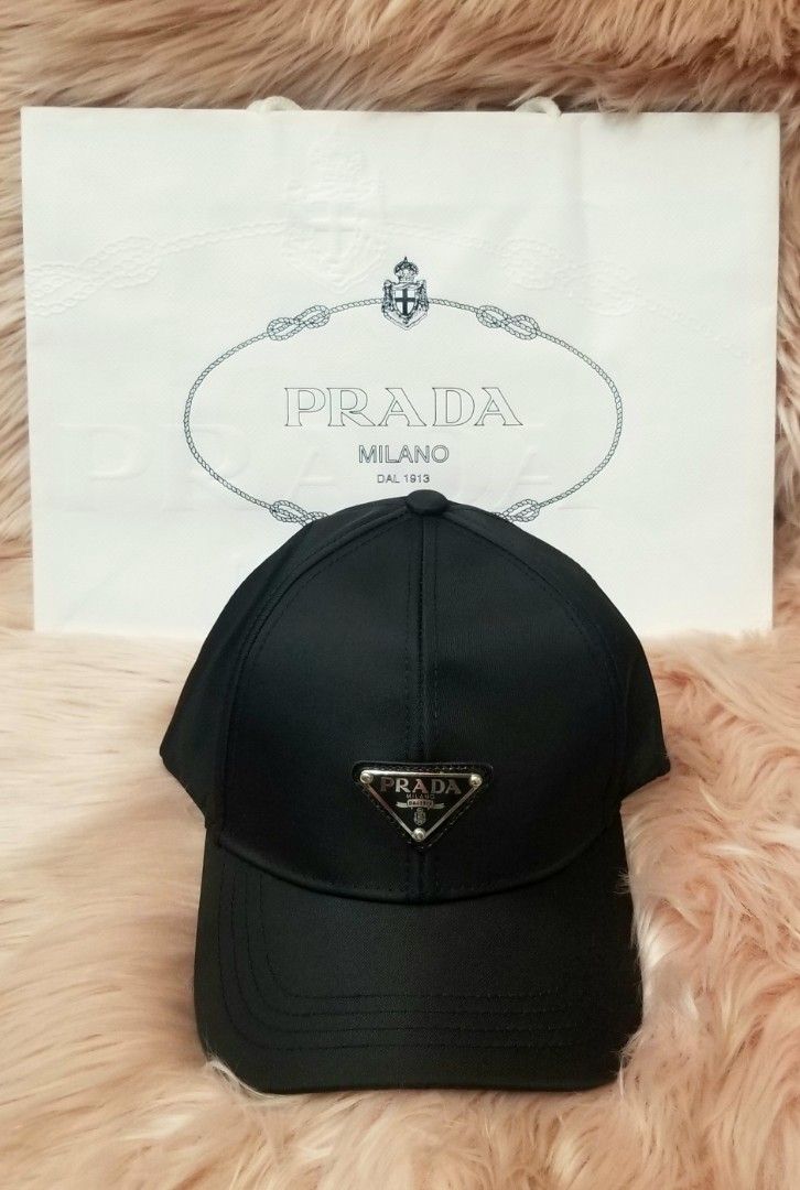 ☆ONHAND!☆ Authentic Prada Men's Silk Canvas Baseball Cap (Category: Caps & Hats) located in Manila. Submitted by ravishing.queen (Listing ID 1269797325, Image 1). Description: ▪︎100% Authentic ▪︎Silk Canvas ▪︎Fits Medium to Large Head ▪︎Adjustable strap at the back area ▪︎Front Logo ▪︎Comes with Prada Paperbag.