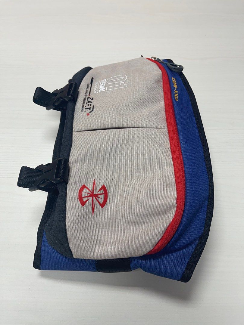 Gundam Seed ZGMF-X10A Freedom Waist Bag (Category: Sling Bags) located in Singapore. Submitted by haze (Listing ID 1270018883, Image 2). Description: **BNWT** Selling a brand new GUNDAM waist bag. Currently I have only 1. Specification: - 1 × Front zipper pocket - 1 × Main compartment - 1 × Front zipper pocket Size: 54 (W) × 22 (H) × 8 (D) cm / 9.5L Weight: About 400g If you are a GUNDAM SEED collector/fan and keen on the bag, do PM me :).