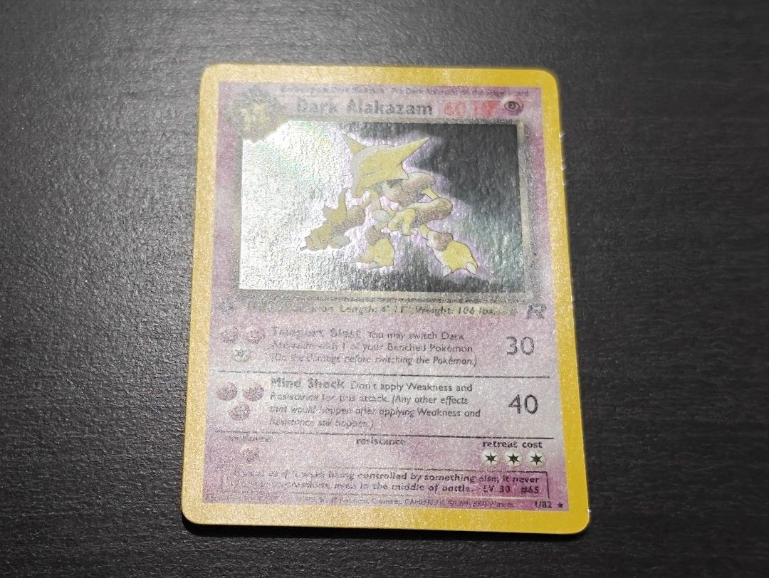 pokemon dark alakazam card (1) [1PP] Teleport Blast (30) You may switch Dark Alakazam with 1 of your Benched Pokemon (Do the damage before switching the Pokemon) Team Rocket Error Identification Guide: