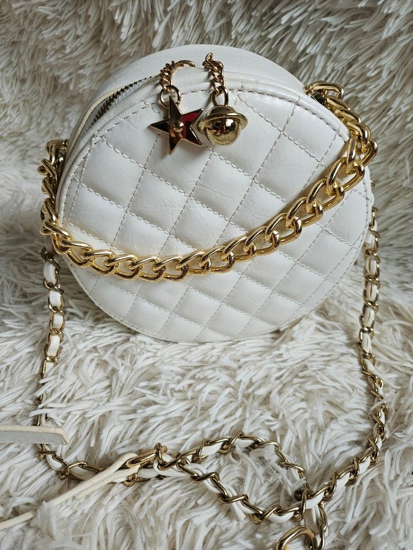 Round quilted bag with gold hardware
