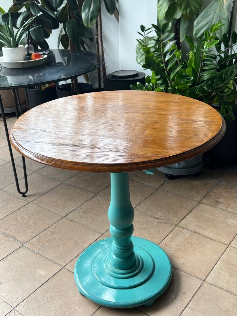 Solid Elm Timber Round Table (Category: Tables & Sets) located in Singapore. Submitted by tokogarasi (Listing ID 1269987784, Image 2). Description: RETRO-MODERN HANDCRAFTED ELM TIMBER TABLE! Beautifully custom designed and made using flawless superior grade solid Elm wood table top, matched with funky Tiffany-teal or retro-red colored leg, decorated with vintage profiles for an interesting twist that will always be a conversational topic for your